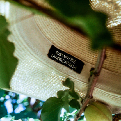 upclose of shop slla ojai hat logo